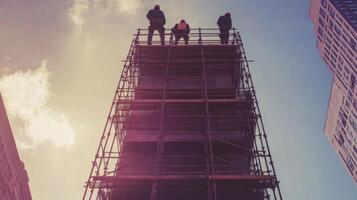 Construction Workers on Scaffolding Looking Up at the Sky photo