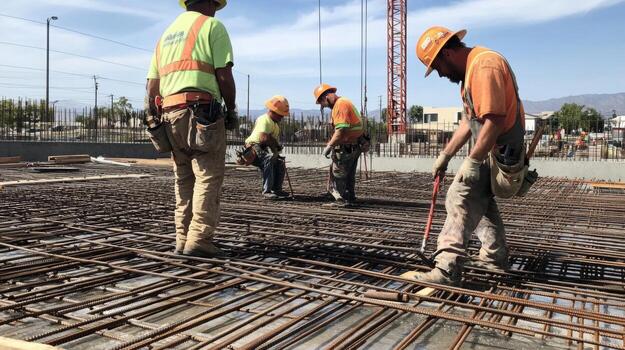 Construction Workers on a Rebar Grid photo