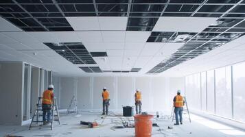 Construction Workers Installing a Suspended Ceiling in an Office Building photo