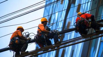 Three Utility Workers on a Power Line Inspection photo