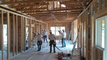 Construction Workers Inside a Home Under Construction photo