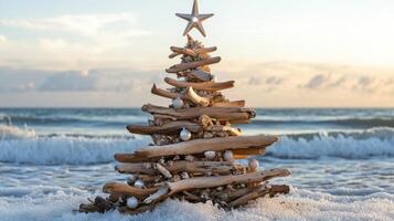 A Driftwood Christmas Tree on a Beach at Sunset photo