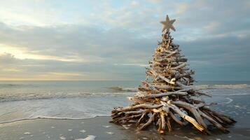Driftwood Christmas Tree on a Sandy Beach with a Star on Top photo