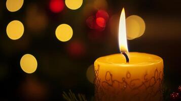 A Lit Candle with Bokeh Lights in the Background photo