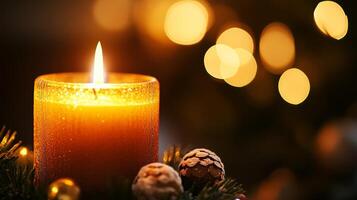 A burning candle with pine needles and pine cones. photo