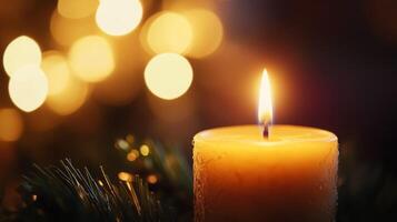 A Single Candle Flame with Golden Bokeh Lights photo