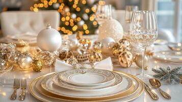 Elegant Christmas Table Setting with Gold Accents and Ornaments photo