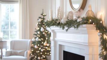 A Christmas-Decorated Fireplace with a Blurred Christmas Tree in the Background photo