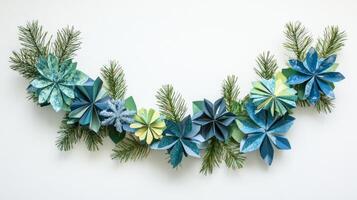 Blue and Green Paper Flowers with Pine Branches on White Background photo