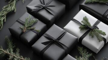 Black and White Gift Boxes with Evergreen Branches photo