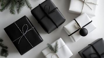 Black and White Gift Boxes with Twine and Ornament photo