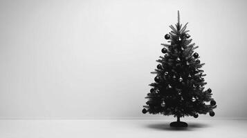 Black Christmas Tree with Ornaments on a White Background photo