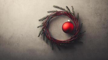 Christmas Wreath with Red Ornament on Grey Background photo