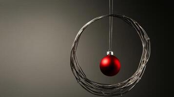 Red Christmas Ornament Hanging in a Wire Circle photo