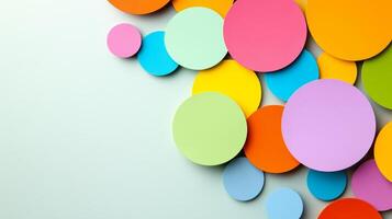 Abstract background with circular paper cut outs in vivid colors on a pale textured surface photo