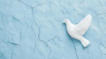Rough grainy stone texture in light blue and white tones for International Peace Day subtle cracks forming a dove shape soft texture adds calmness and serenity to the image photo