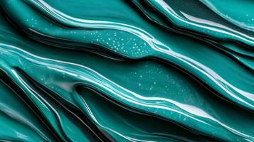 Close up of liquid waves in shades of cobalt and jade intertwining in a fluid dance photo
