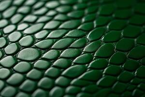 Closeup of snake leather texture in dark green fine scales with subtle shine and intricate pattern photo