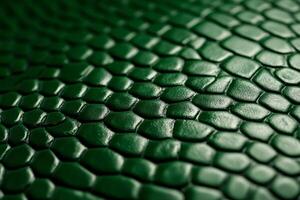 Closeup of snake leather texture in dark green fine scales with subtle shine and intricate pattern photo