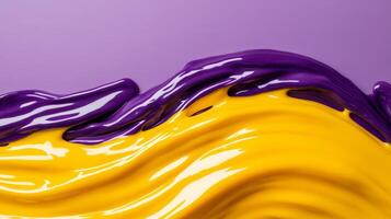 Macro image of liquid waves of yellow and purple intertwining with dynamic flow photo
