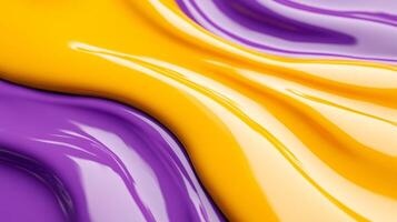 Macro image of liquid waves of yellow and purple intertwining with dynamic flow photo