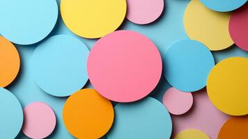 Abstract background with circular paper cut outs in vivid colors on a pale textured surface photo