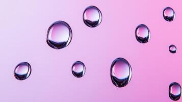 Drops of water on glass creating abstract shapes with a gradient pink and purple background photo
