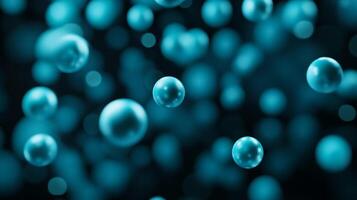 Paint bubbles in electric blues and greens glowing against a dark background photo