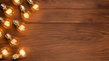 Overhead view of multiple light bulbs with different filaments on a rustic wooden table photo