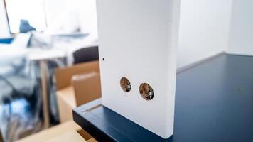A close up of an unfinished DIY furniture piece assembly in a modern home setting highlighting home improvement and construction photo