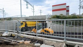 Construction of new infrastructure under the railway bridge working on road safety improvement photo