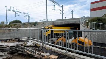 Construction site with heavy machinery under a bridge, highlighting urban development challenges photo