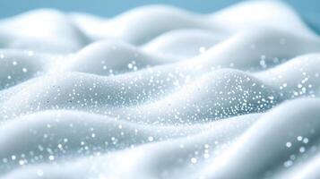Closeup of a creamy snow white serum with tiny iridescent flakes resembling a glistening winter frost photo