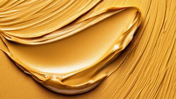 Closeup of golden highlighter cream texture with fine metallic flecks on a smooth surface luxurious beauty product detail photo