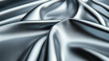 Closeup of metallic silver leather with a subtle shine and soft texture capturing light reflections delicately photo
