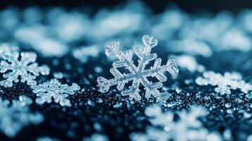Closeup of translucent snowflake shaped highlighter particles scattered across a deep navy blue surface photo