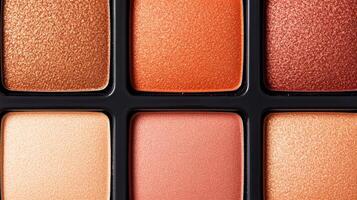 Copper and maple hued highlighter palette closeup with each shade in a rich autumn gradient against a white background photo