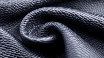 Deep charcoal grey leather with a subtle pebble grain and a slightly distressed surface in a detailed macro view photo