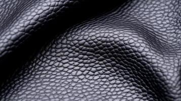 Deep charcoal grey leather with a subtle pebble grain and a slightly distressed surface in a detailed macro view photo