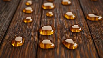 Droplets of bronze serum oil on a dark brown wooden surface capturing the essence of autumn warmth photo