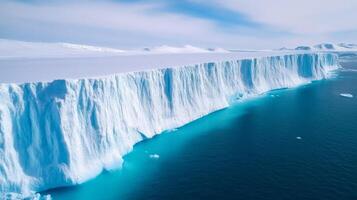 Expansive ice shelf collapsing into the ocean from space cracked icebergs breaking off into turquoise waters photo