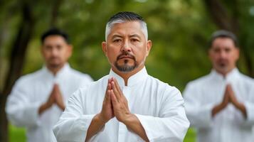 Group of men practicing tai chi in a park diverse ages and backgrounds gentle movements photo