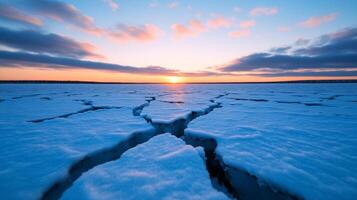 Intense frostquake in a frozen tundra huge cracks forming in thick ice under a bright winter sky photo