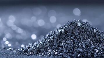 Macro of cool taupe eyeshadow powder with a fine shimmering finish sprinkled on an icy grey background photo