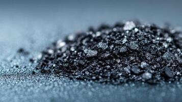 Macro of cool taupe eyeshadow powder with a fine shimmering finish sprinkled on an icy grey background photo