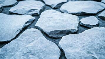 Macro view of glacier grey leather with a subtle metallic finish resembling snow covered rocks in winter photo
