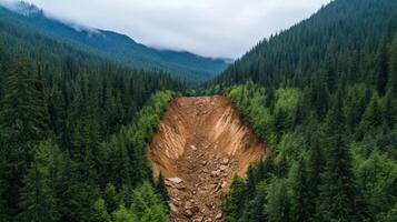 Massive landslide crushing a mountainside rocks and debris sliding down violently through dense green forest photo