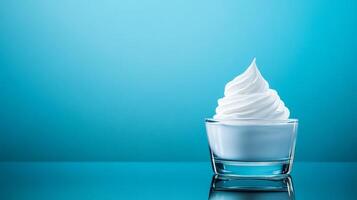 Pearly white moisturizer cream swirl on a smooth glass surface with a faint reflection and subtle iridescence photo
