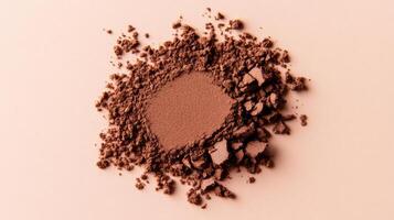 Rich cocoa and caramel eyeshadow blending seamlessly in a warm gradient on a light peach surface photo