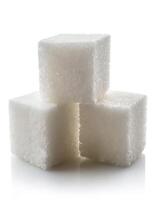Close-up of three white sugar cubes, isolated on white background photo